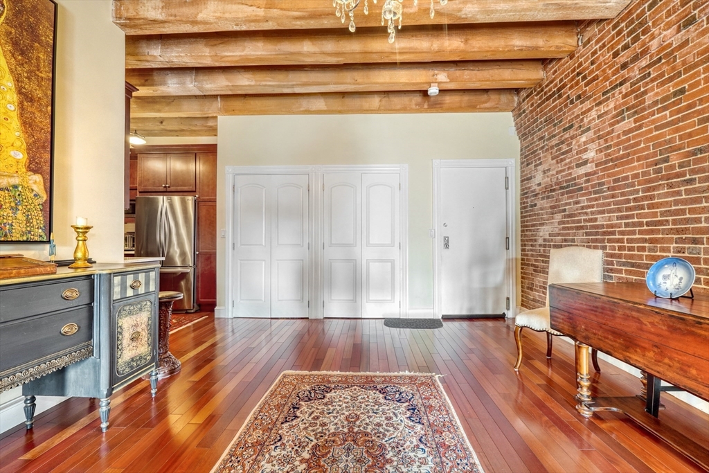 28-32 Atlantic Avenue, Unit 424 Boston, MA 02110 - Photo 9 of 38 a view of hallway with wooden floor