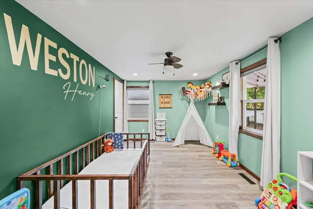 a view of walk in closet with clothes