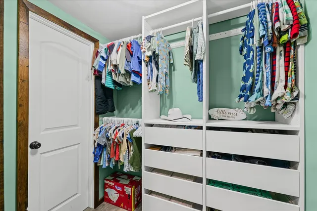 a bedroom with a bed and furniture