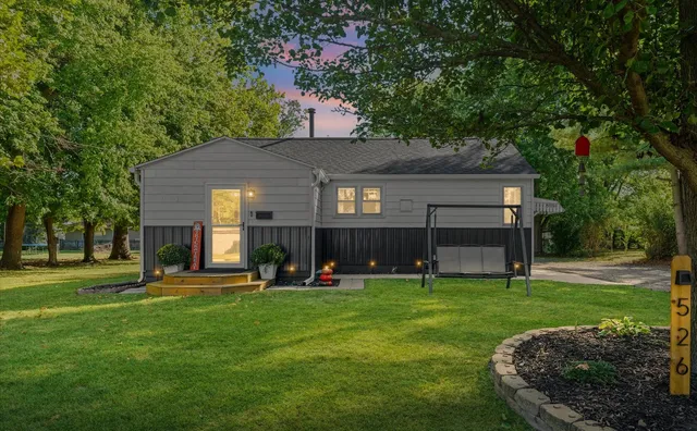 a view of a house with a backyard