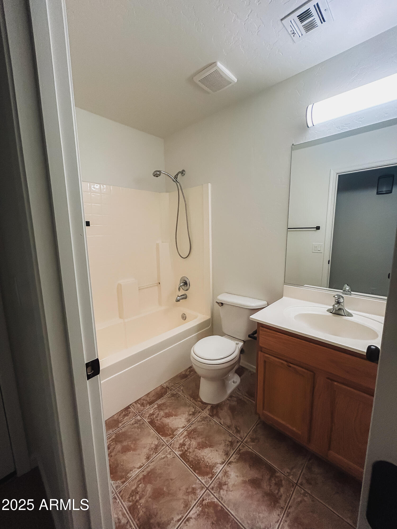14857 West Hearn Road Surprise, AZ 85379 - Photo 16 of 20 a bathroom with a sink a toilet and shower