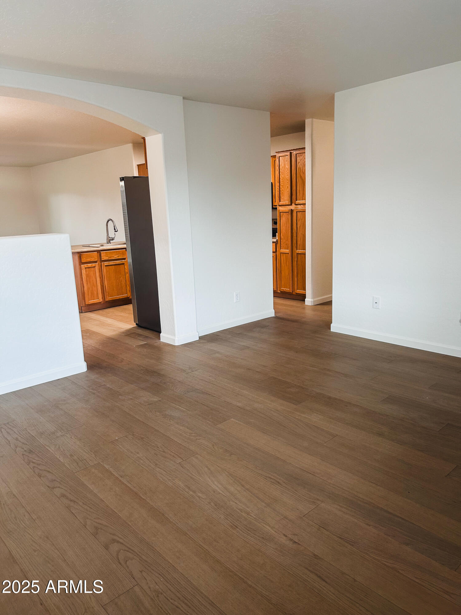 14857 West Hearn Road Surprise, AZ 85379 - Photo 3 of 20 a view of a hallway with wooden floor and stairs