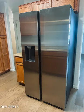 a refrigerator freezer sitting inside of a kitchen