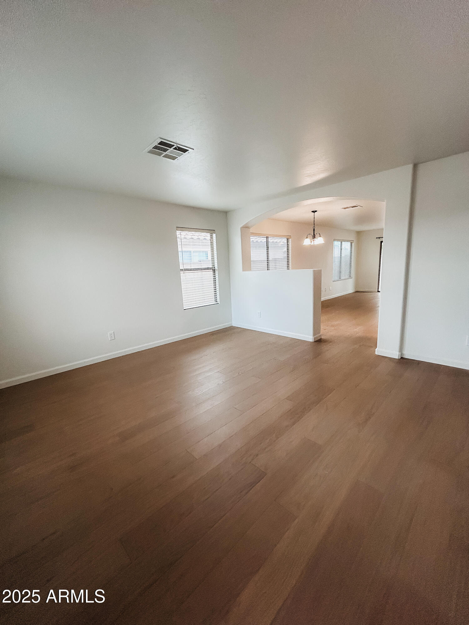 14857 West Hearn Road Surprise, AZ 85379 - Photo 10 of 20 en empty room with windows and fireplace