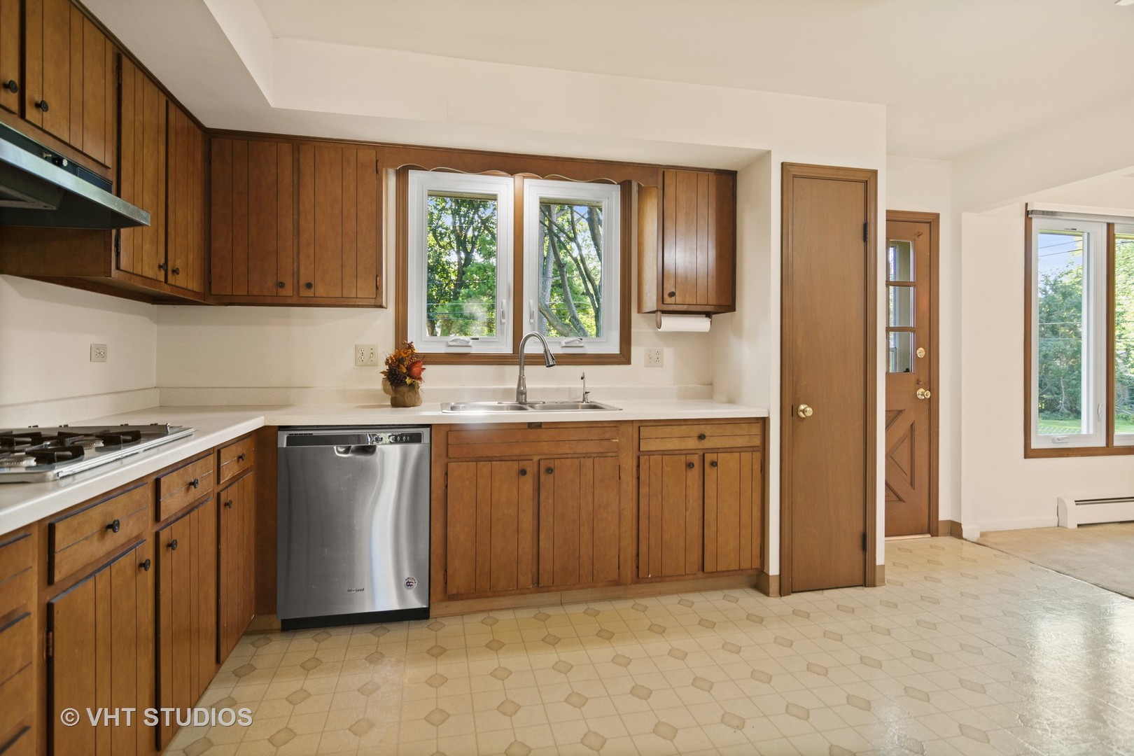 975 Ruth Drive Elgin, IL 60123 - Photo 6 of 17 a kitchen with sink cabinets and window