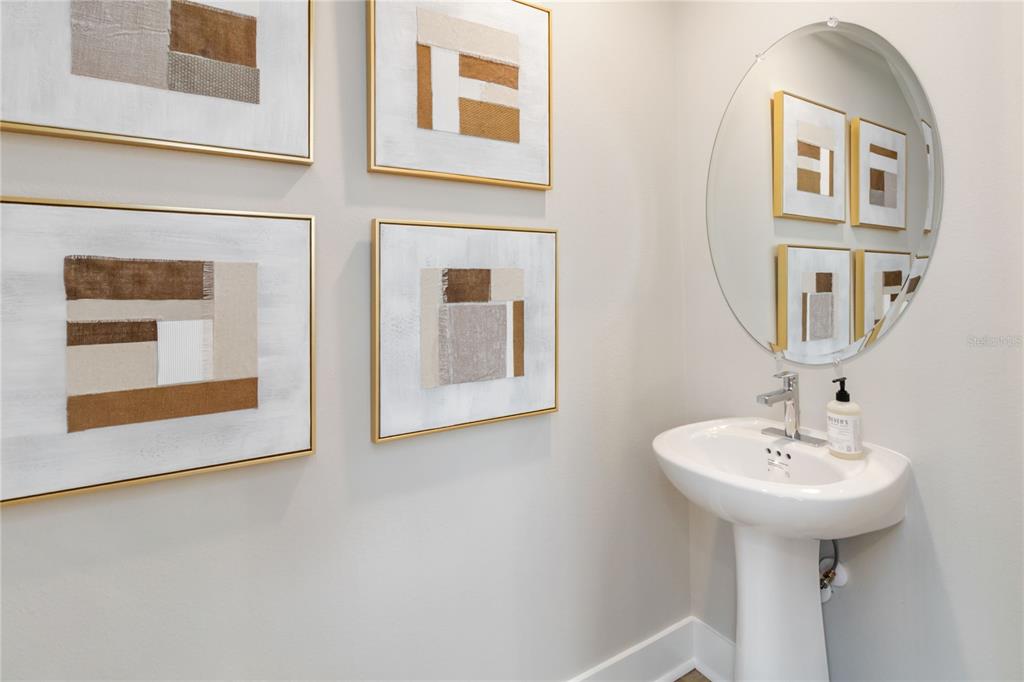 1129 Orange Trailside Way Ocoee, FL 34761 - Photo 10 of 31 a bathroom with a sink and a mirror