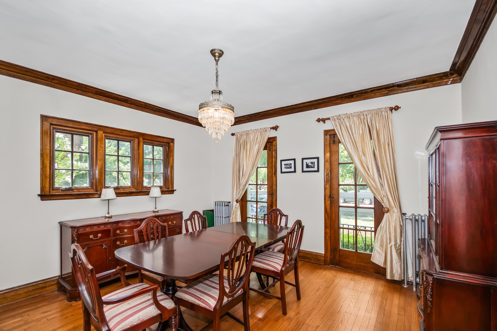 525 Wisner Street Park Ridge, IL 60068 - Photo 7 of 37 a dining room with furniture a chandelier and wooden floor