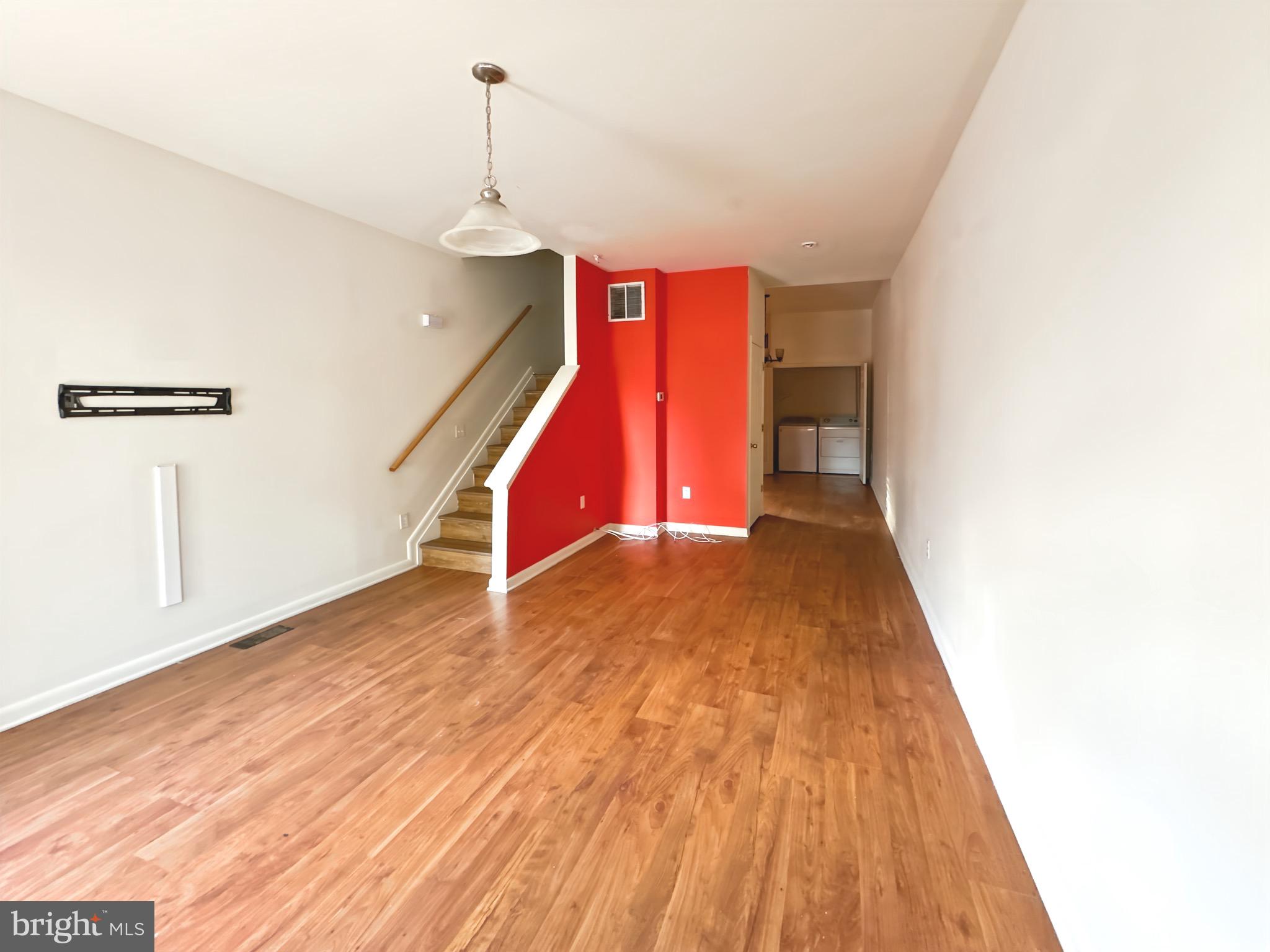 2426 Jefferson Street Baltimore, MD 21205 - Photo 3 of 17 a view of an empty room with wooden floor