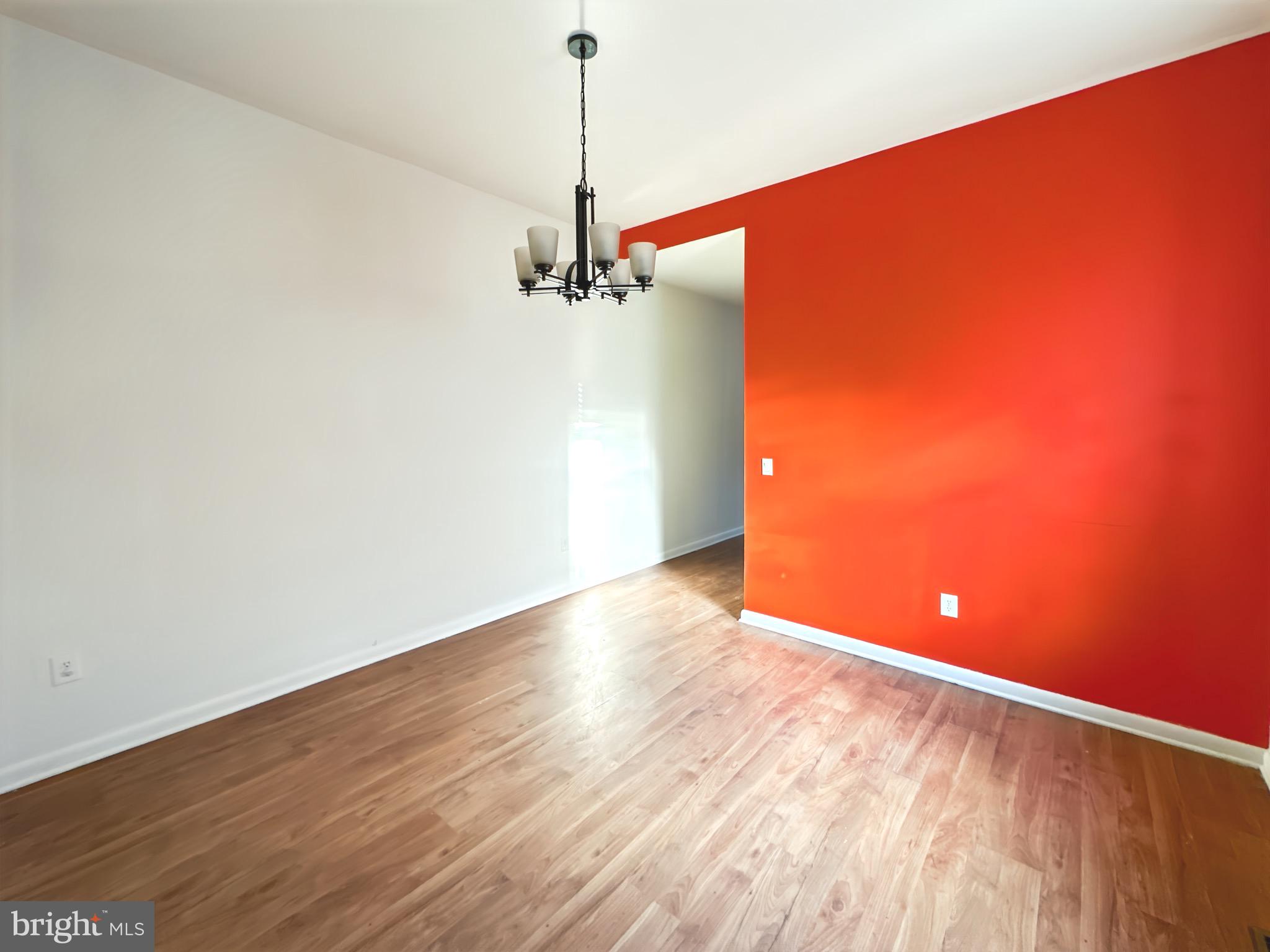 2426 Jefferson Street Baltimore, MD 21205 - Photo 5 of 17 a view of a room with wooden floor