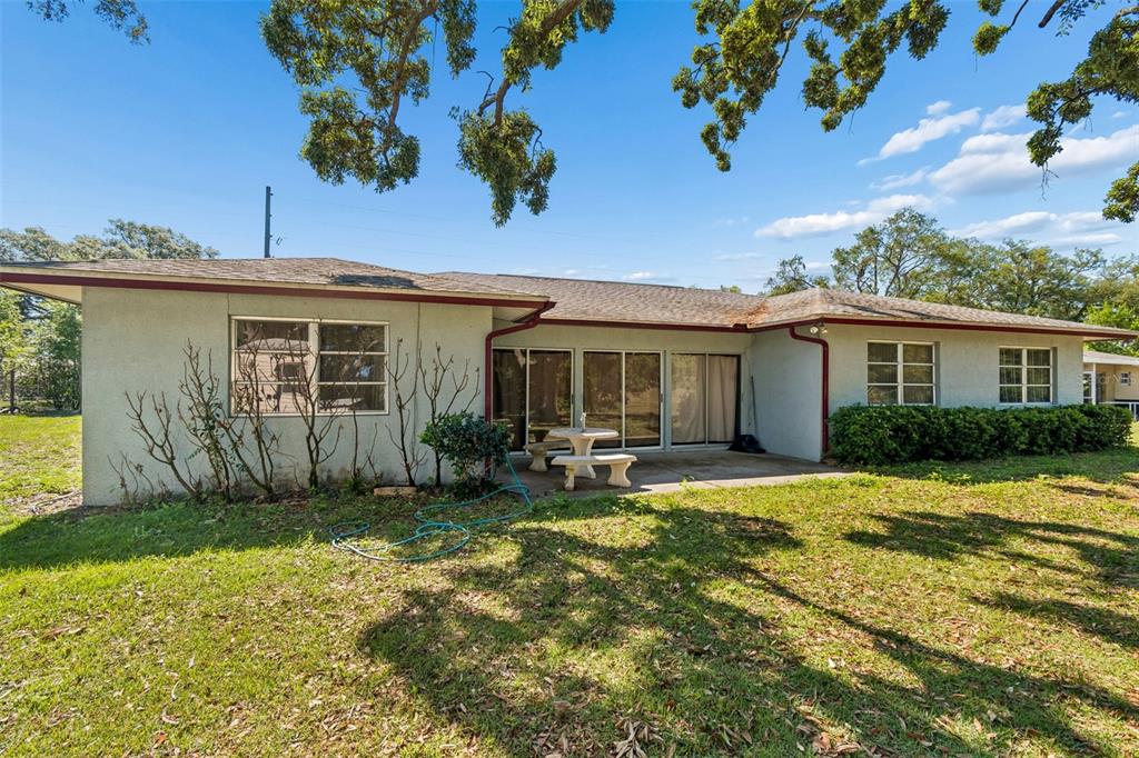 2059 Waterfall Drive Spring Hill, FL 34608 - Photo 24 of 26 a view of a house with a patio