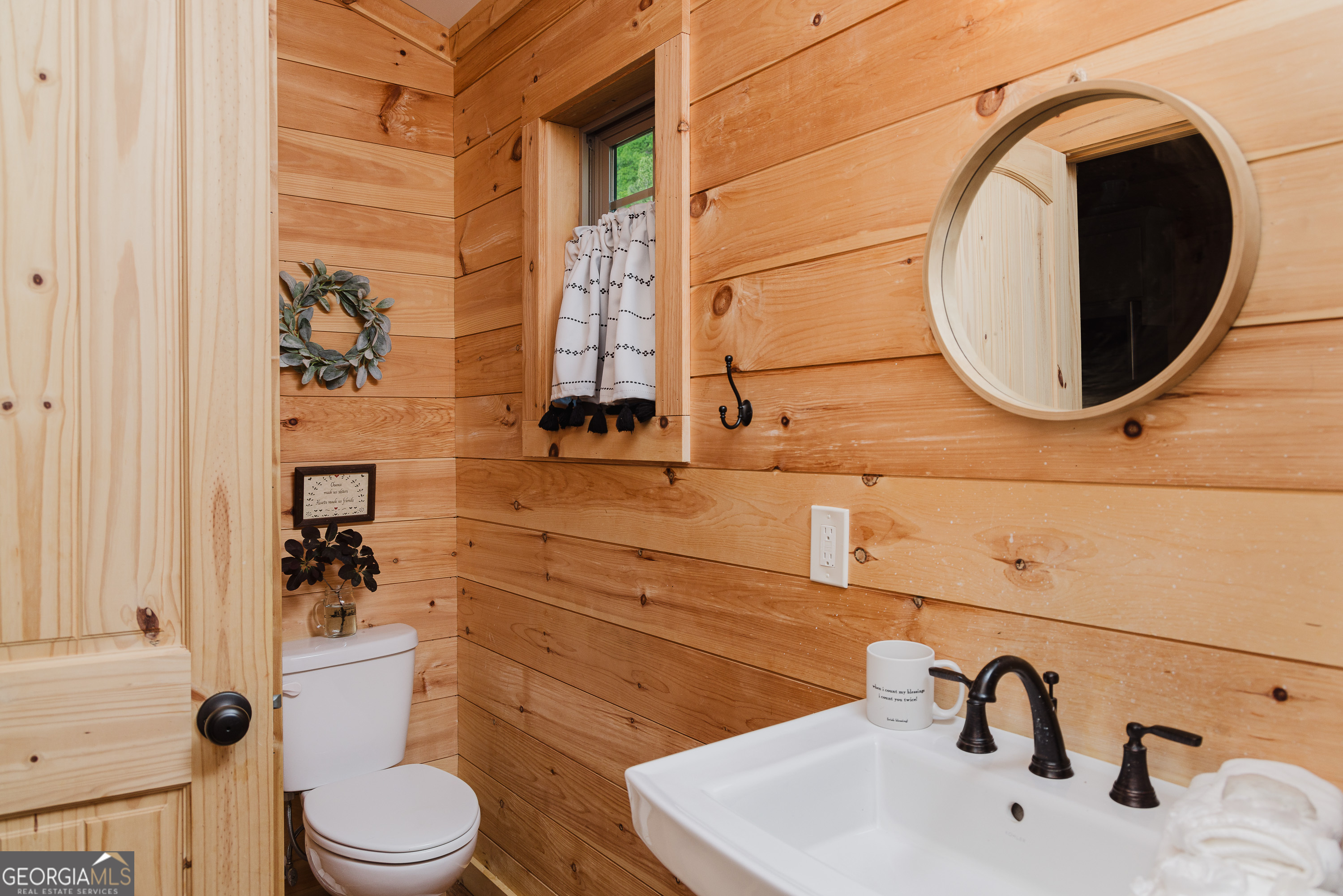 36 Maple Springs Lane Clayton, GA 30525 - Photo 11 of 26 a bathroom with a toilet sink and mirror