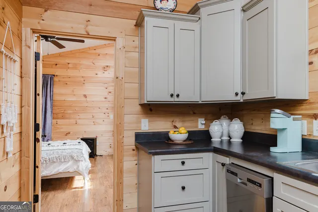 a kitchen with a sink and cabinets