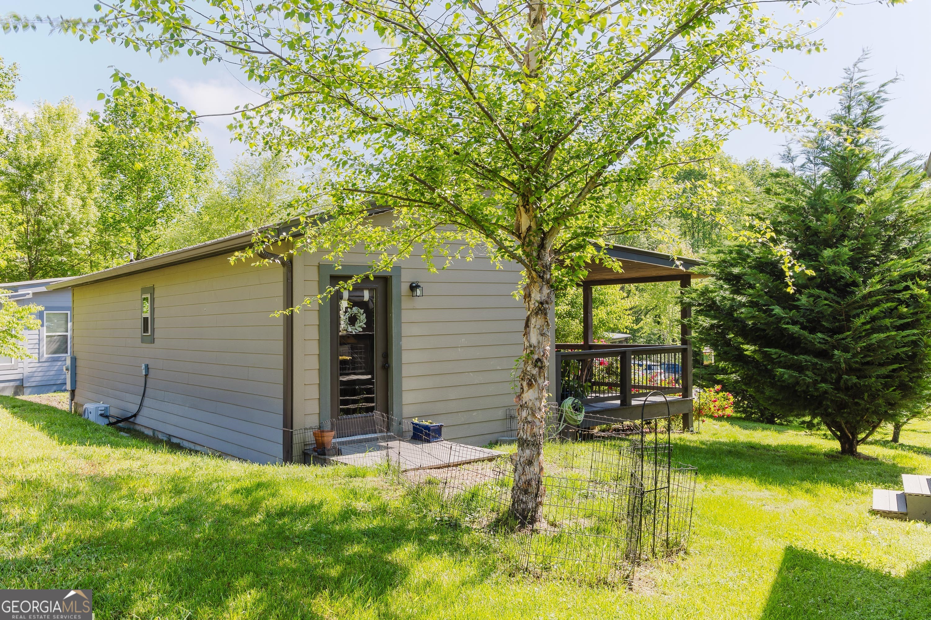 36 Maple Springs Lane Clayton, GA 30525 - Photo 24 of 26 a view of a house with pool and sitting area