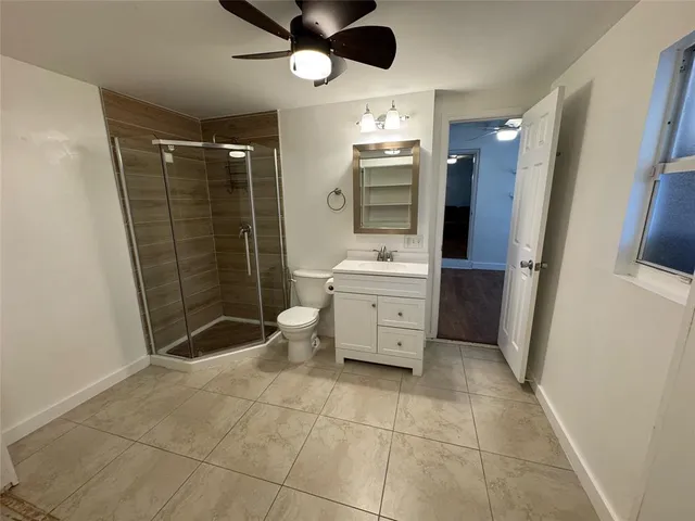 a dining room with furniture and chandelier