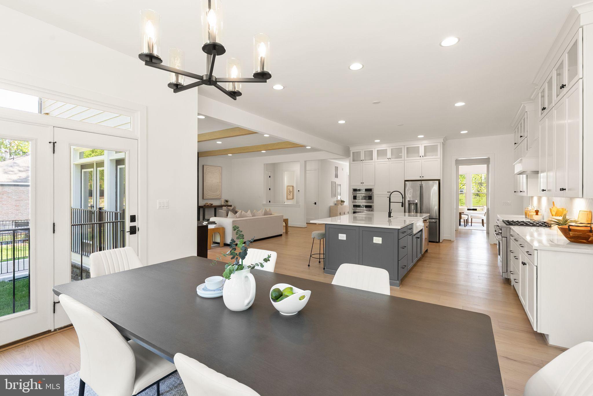 7207 Barnett Road Bethesda, MD 20817 - Photo 7 of 27 a open dining room with furniture wooden floor and kitchen view