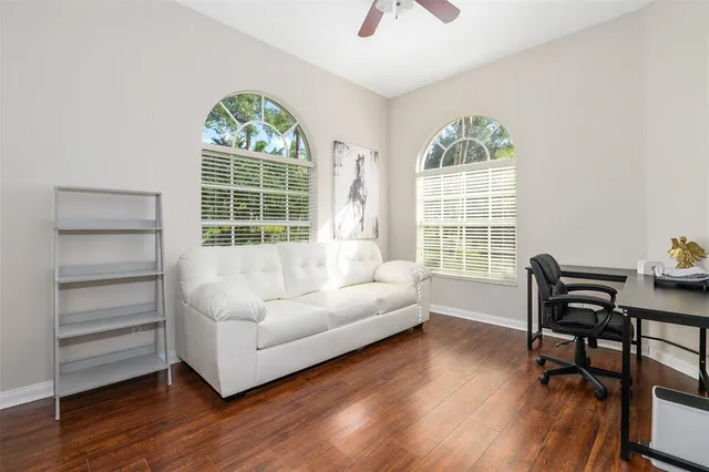 a living room with furniture and a window