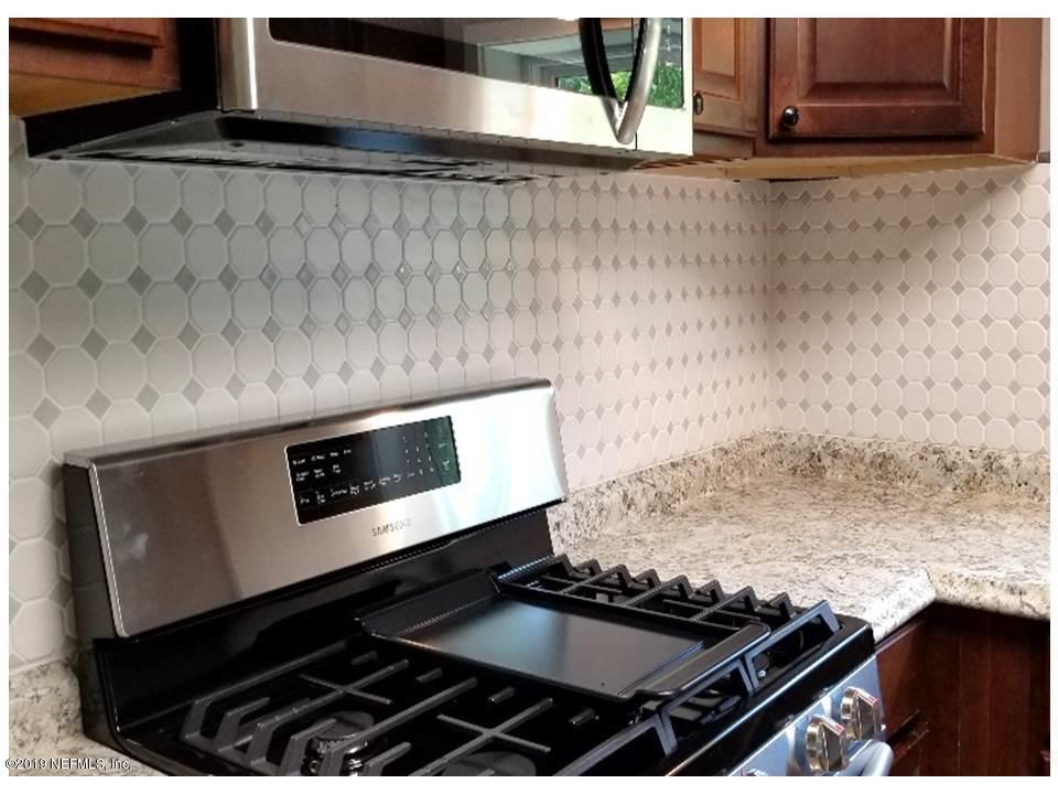 5209 Yellow Water Road Jacksonville, FL 32234 - Photo 7 of 25 gas stove & backsplash