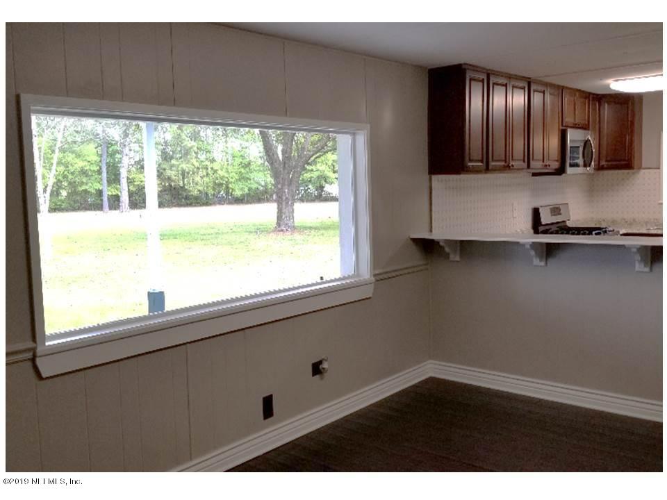 5209 Yellow Water Road Jacksonville, FL 32234 - Photo 10 of 25 Dining room window overlooking patio