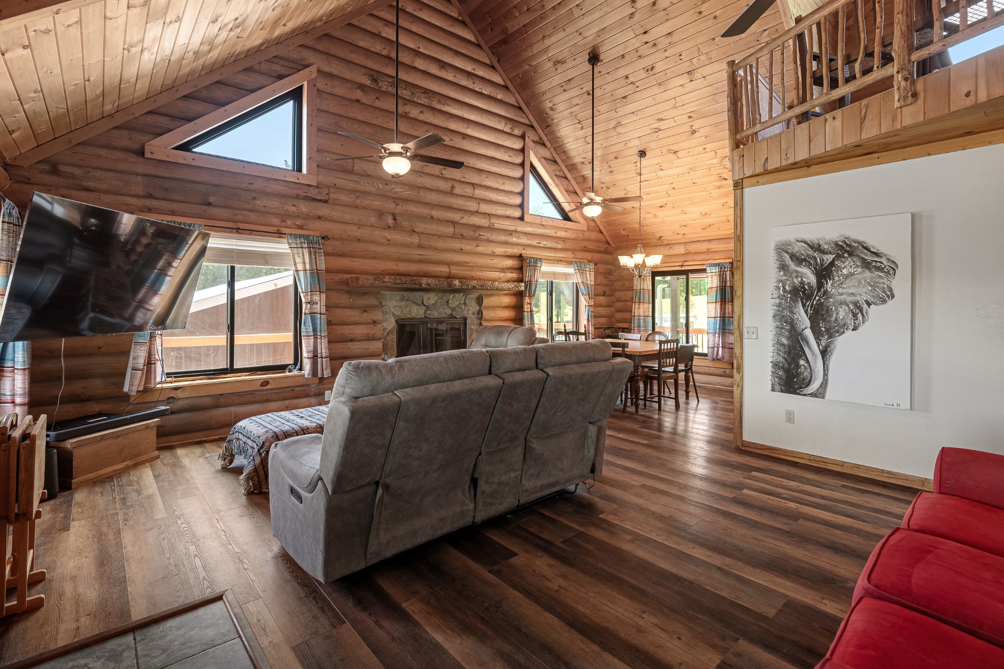 642 Beach Bottom Road Watertown, TN 37184 - Photo 18 of 48 a living room with furniture wooden floor and floor to ceiling windows