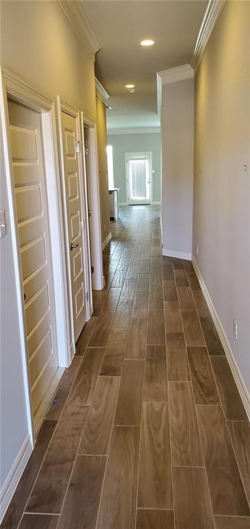 100 Bailey Kay Court, Unit B Jarrell, TX 76537 - Photo 2 of 14 Hall featuring wood finish floors and ornamental molding