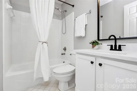 a bathroom with a sink a toilet and a tub
