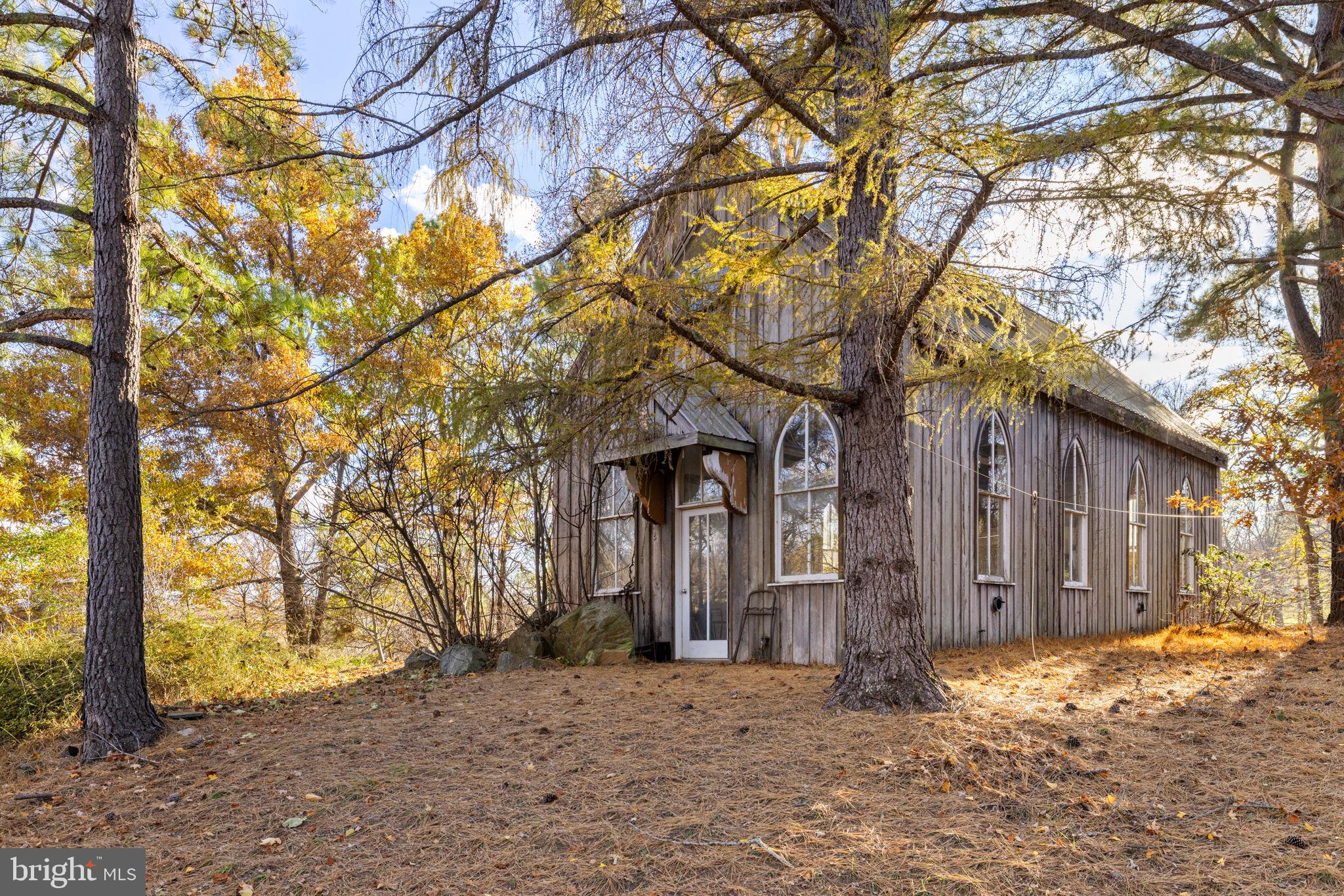 3393 Lost Corner Road Delaplane, VA 20144 - Photo 4 of 6 a front view of a house with a yard covered in snow