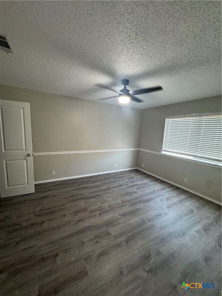 2810 Daniel Boone Trail Temple, TX 76502 - Photo 13 of 18 a view of an empty room with wooden floor and a window