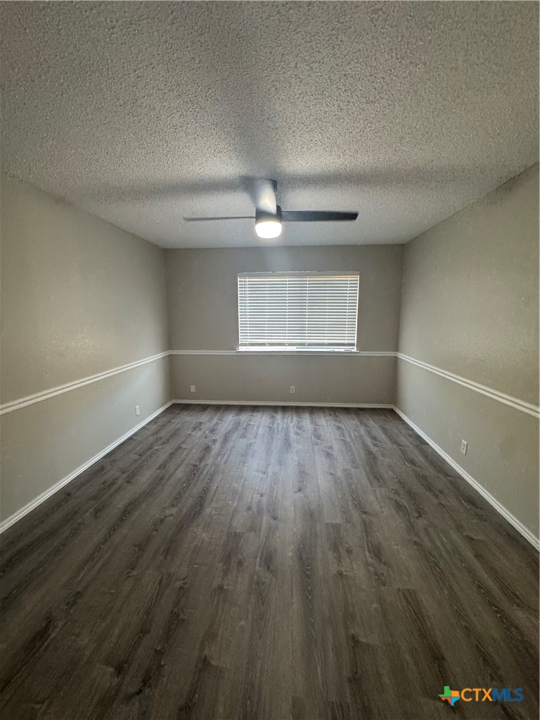 2810 Daniel Boone Trail Temple, TX 76502 - Photo 14 of 18 an empty room with wooden floor and windows