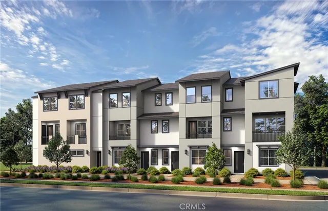 front view of a brick house with a yard