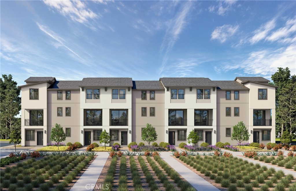 12720 Azure Way, Unit 28 Hawthorne, CA 90250 - Photo 2 of 5 a front view of a residential apartment building with a yard