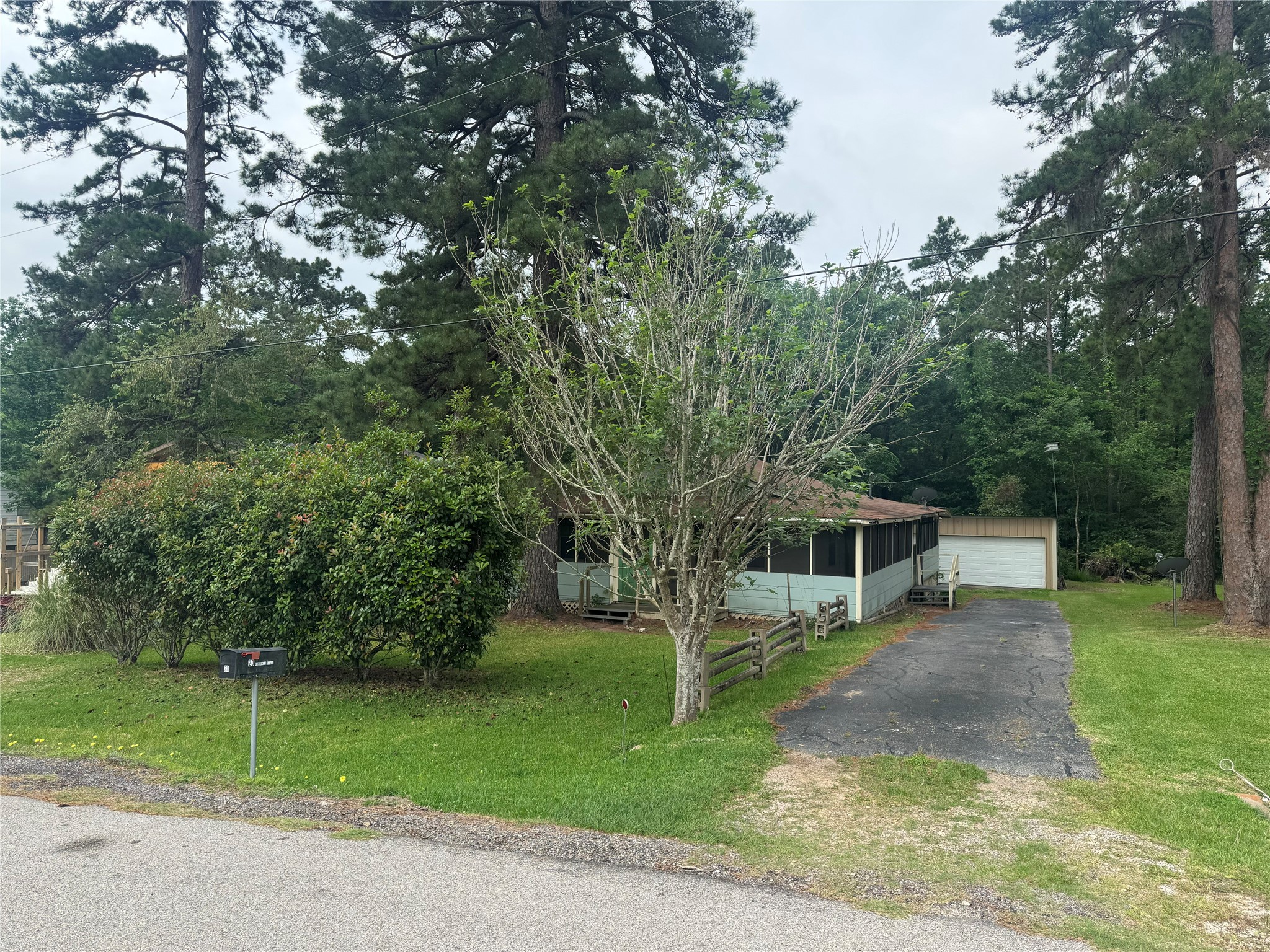 20 Hideaway Trail Coldspring, TX 77331 - Photo 2 of 24 a view of a house with a backyard