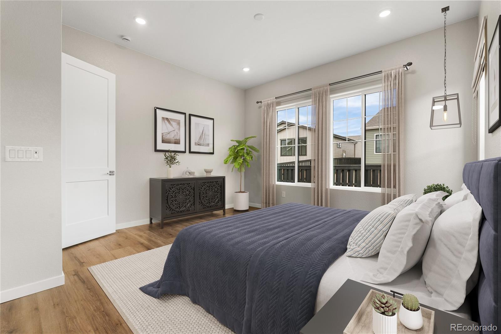 11116 Stonepath Street Littleton, CO 80125 - Photo 25 of 31 a bed sitting in a bedroom next to a window