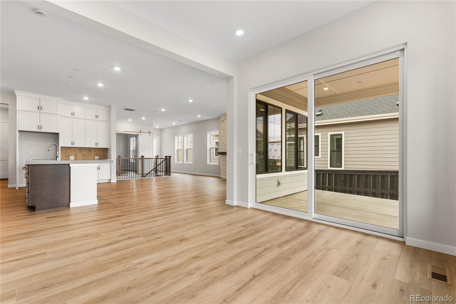 11116 Stonepath Street Littleton, CO 80125 - Photo 5 of 31 a view of kitchen with stainless steel appliances cabinets and wooden floor