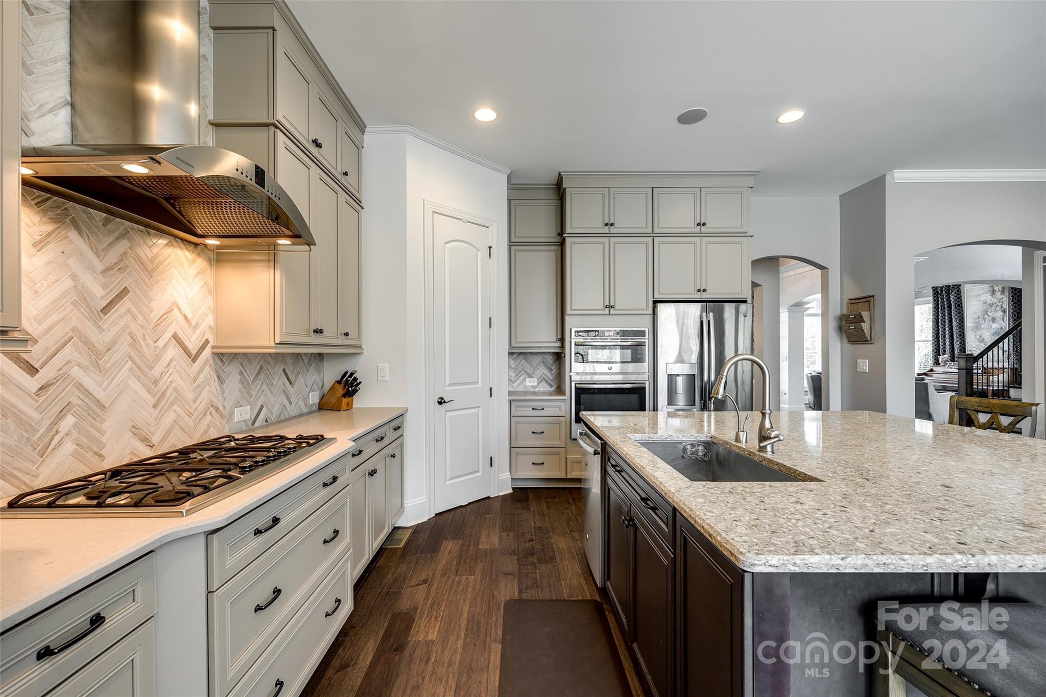 2264 Watermark Point Place Fort Mill, SC 29708 - Photo 11 of 48 a kitchen with granite countertop a sink stove and refrigerator