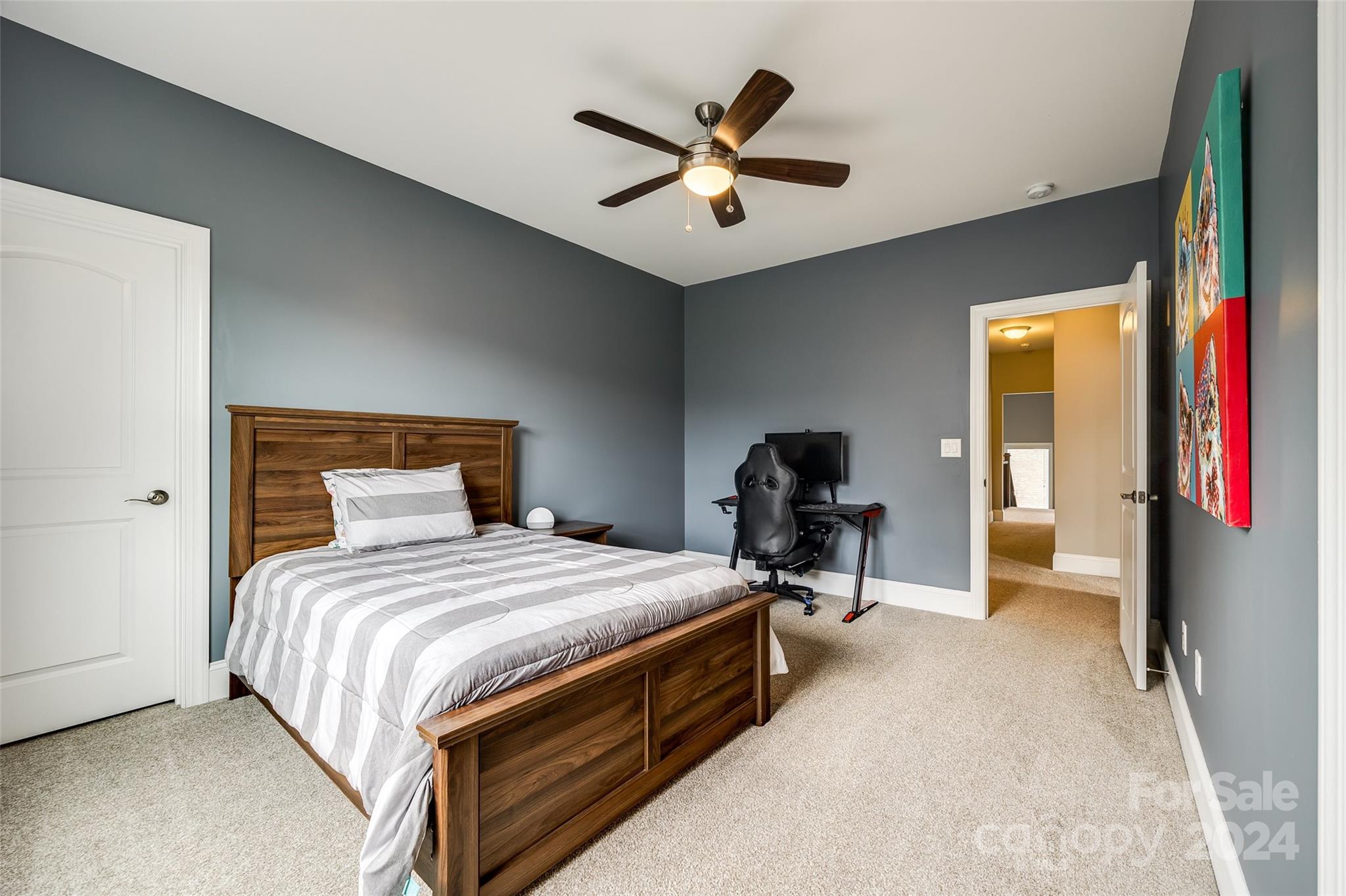 2264 Watermark Point Place Fort Mill, SC 29708 - Photo 24 of 48 a bedroom with a bed and a chandelier