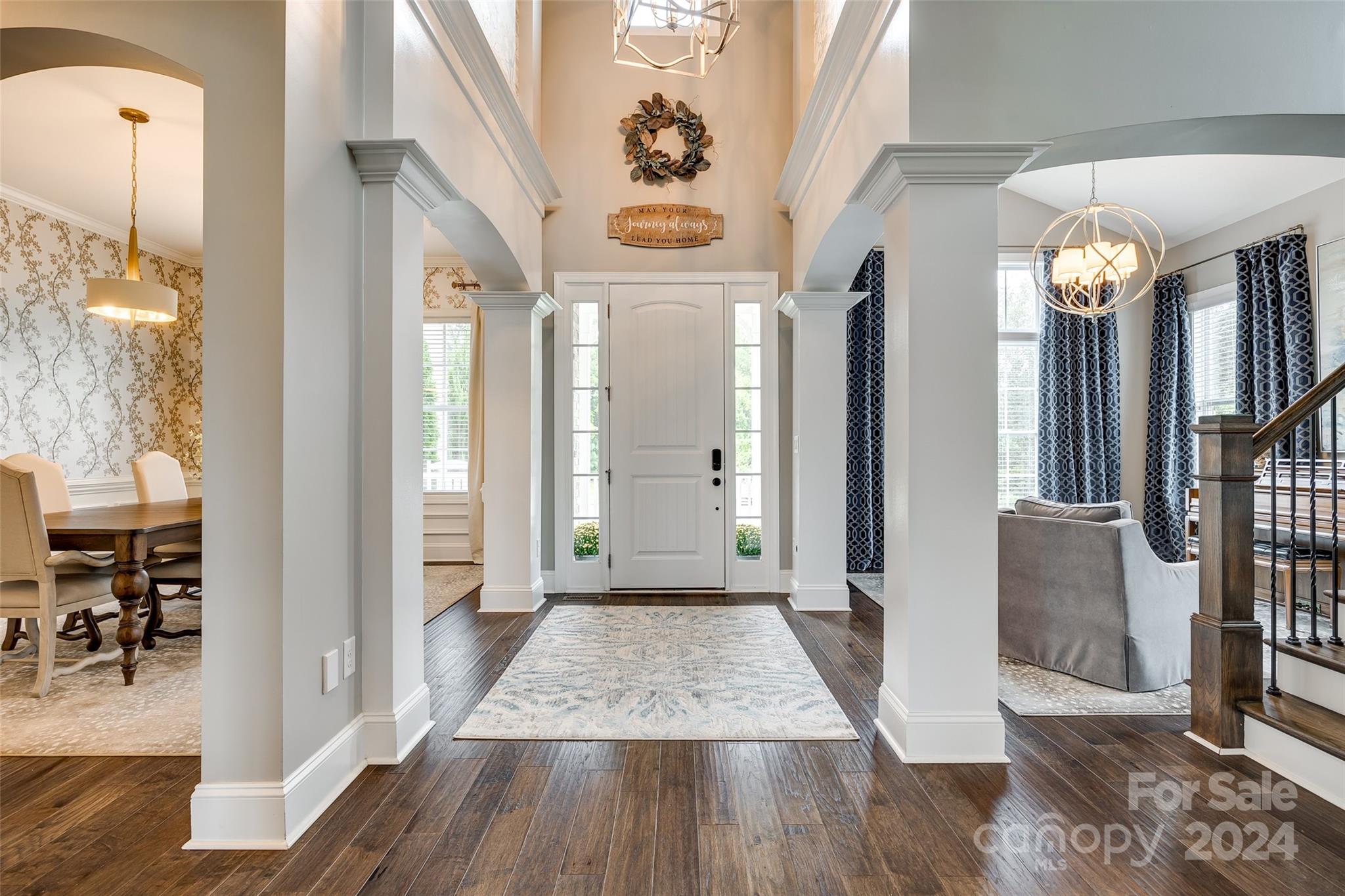 2264 Watermark Point Place Fort Mill, SC 29708 - Photo 3 of 48 a view of a hallway view with wooden floor and staircase