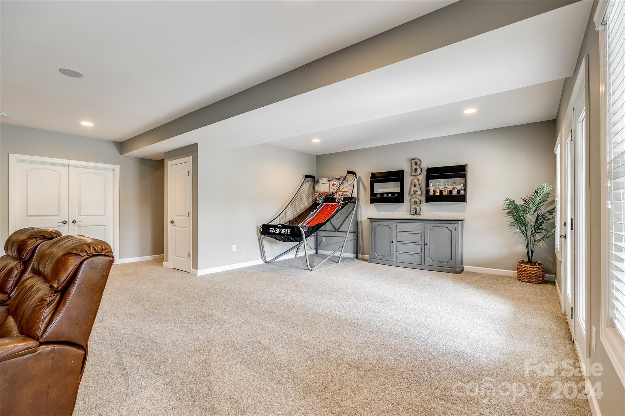 2264 Watermark Point Place Fort Mill, SC 29708 - Photo 33 of 48 a living room with furniture gym equipment and a potted plant