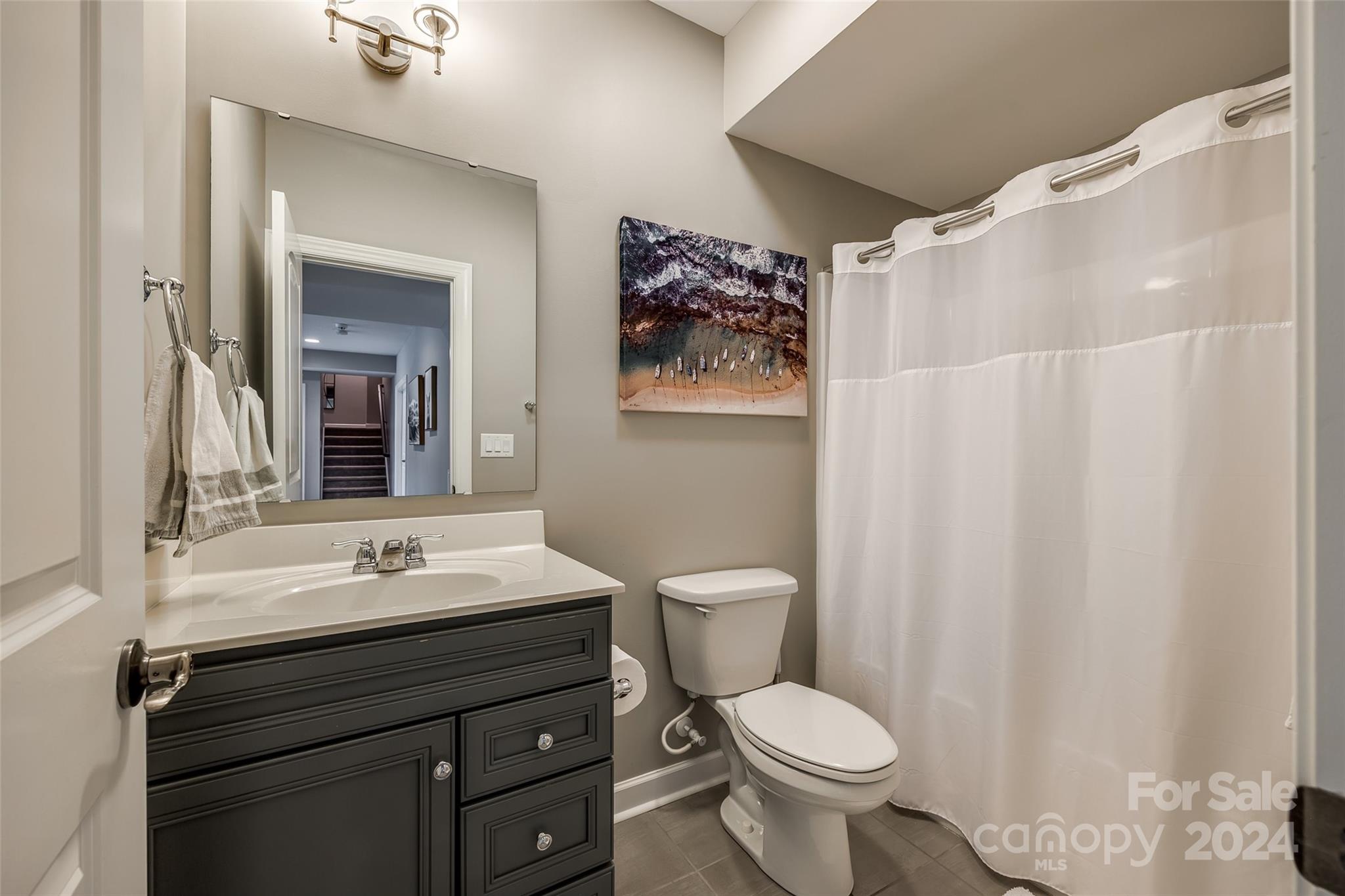 2264 Watermark Point Place Fort Mill, SC 29708 - Photo 36 of 48 a bathroom with a sink toilet and mirror