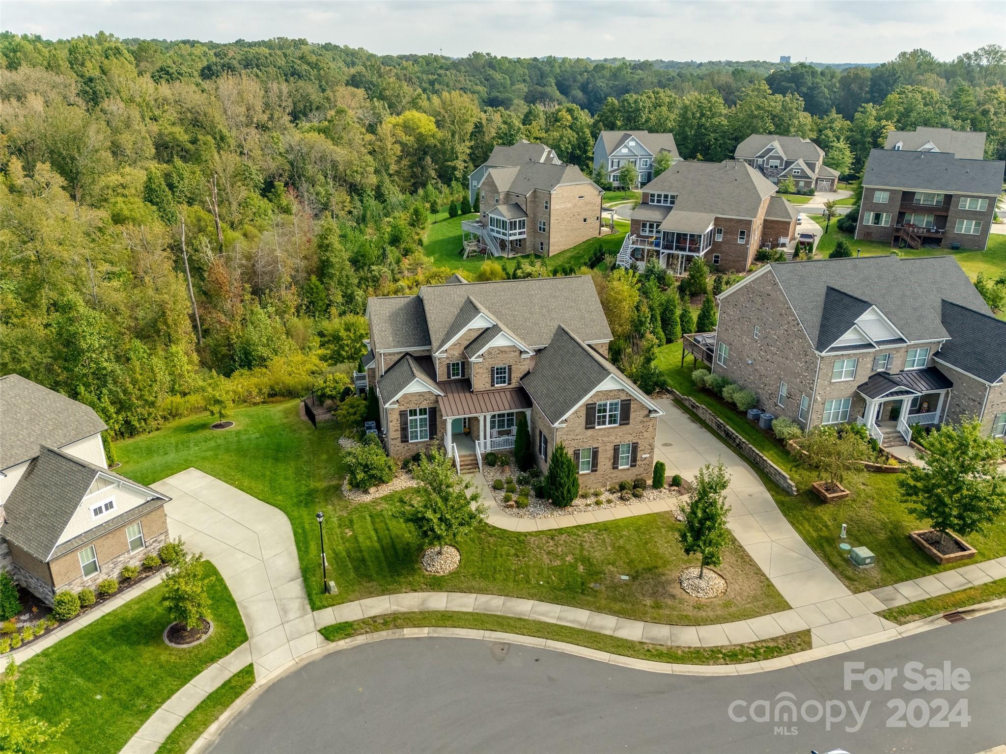 2264 Watermark Point Place Fort Mill, SC 29708 - Photo 43 of 48 an aerial view of a house with a garden and lake view
