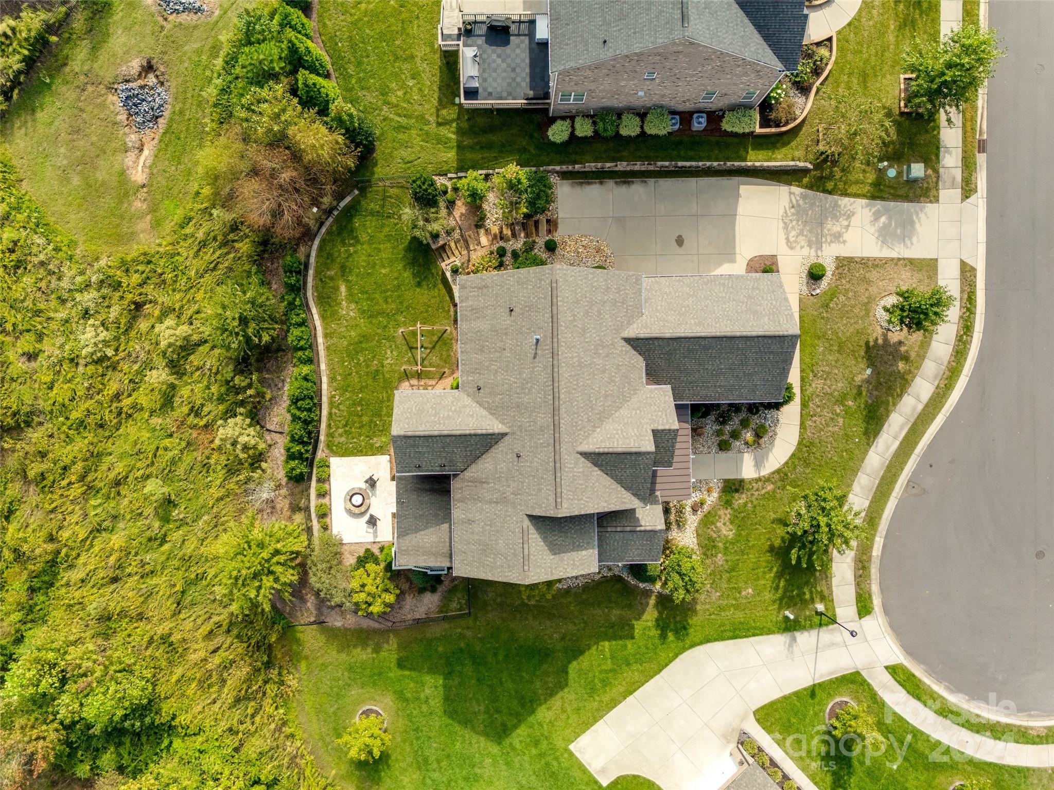 2264 Watermark Point Place Fort Mill, SC 29708 - Photo 45 of 48 an aerial view of a house with swimming pool and large trees