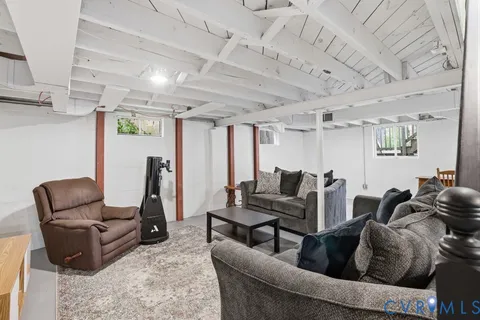 a view of a livingroom with furniture and a flat screen tv