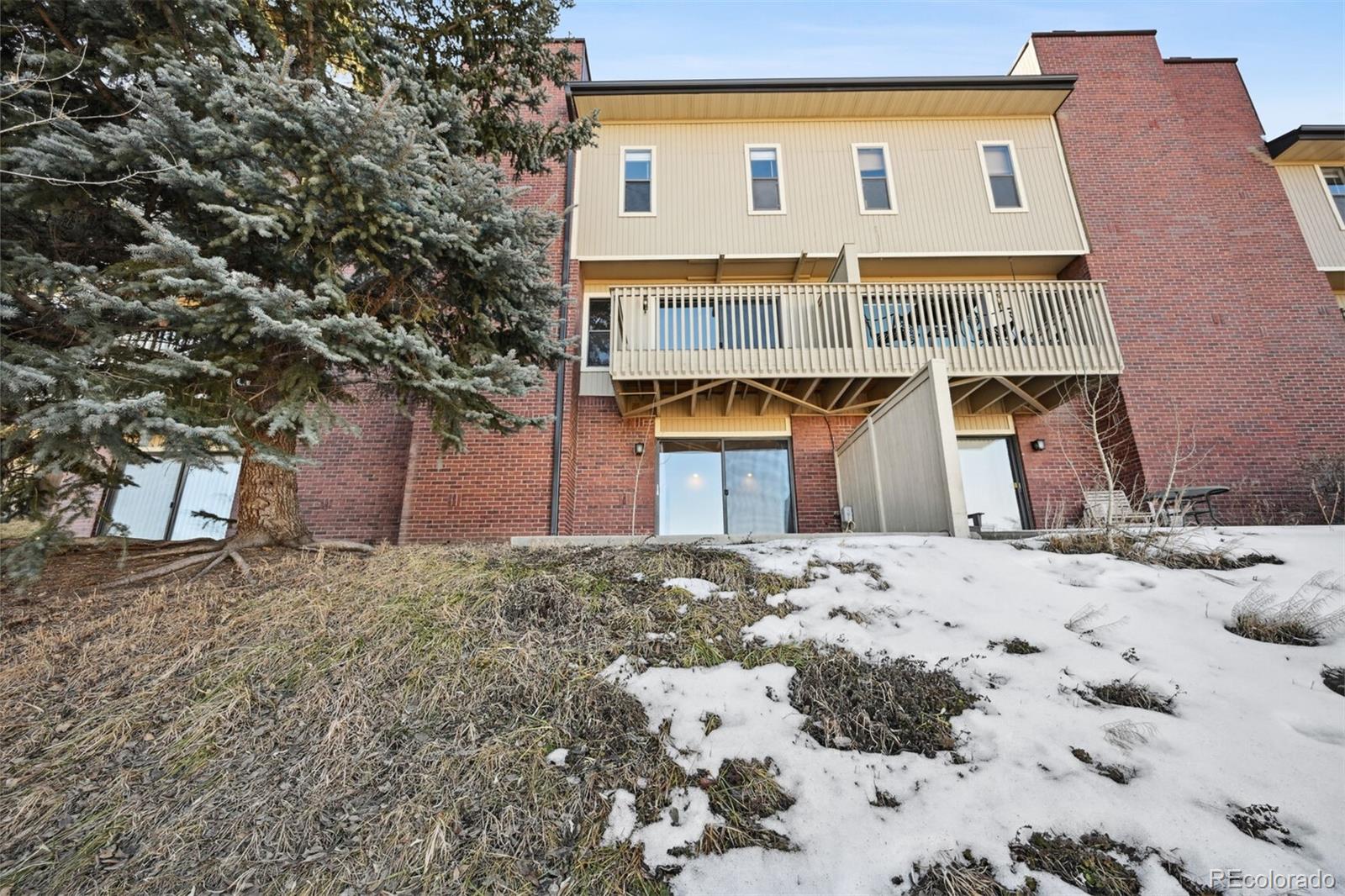 72 South Holman Way Golden, CO 80401 - Photo 28 of 34 a front view of a house with a yard covered in snow