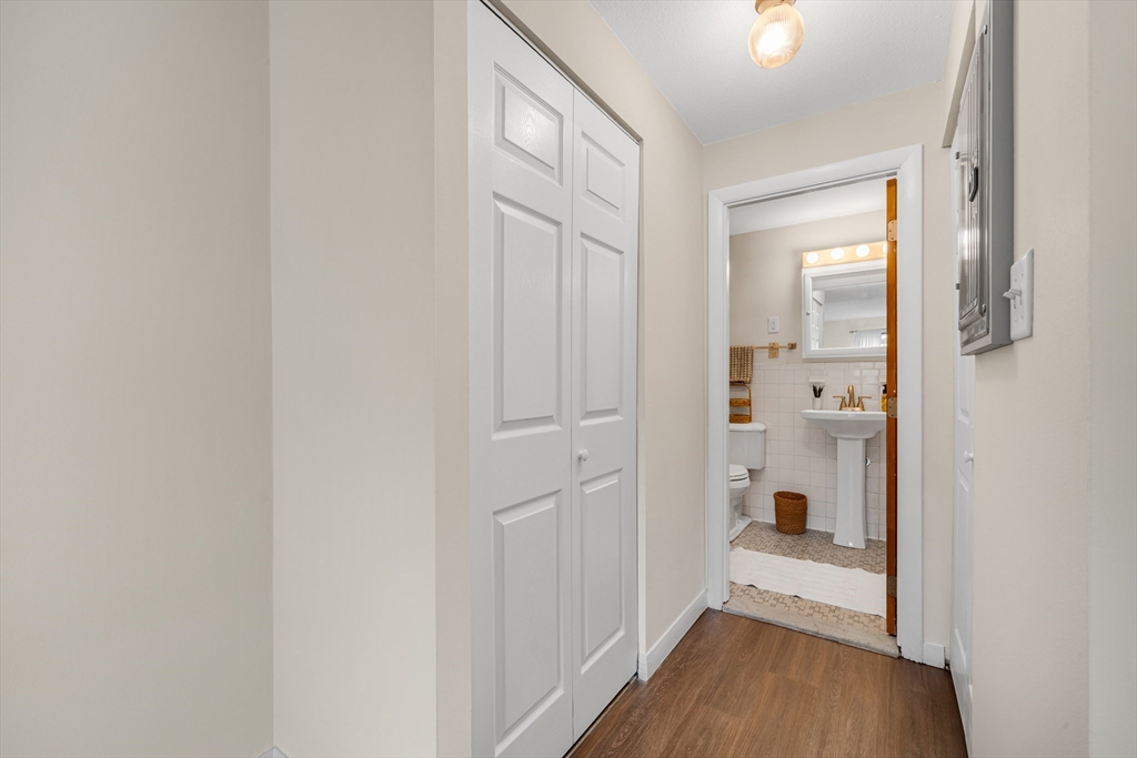 74 Beach Street, Unit 11 Woburn, MA 01801 - Photo 24 of 34 a view of a bathroom from a hallway