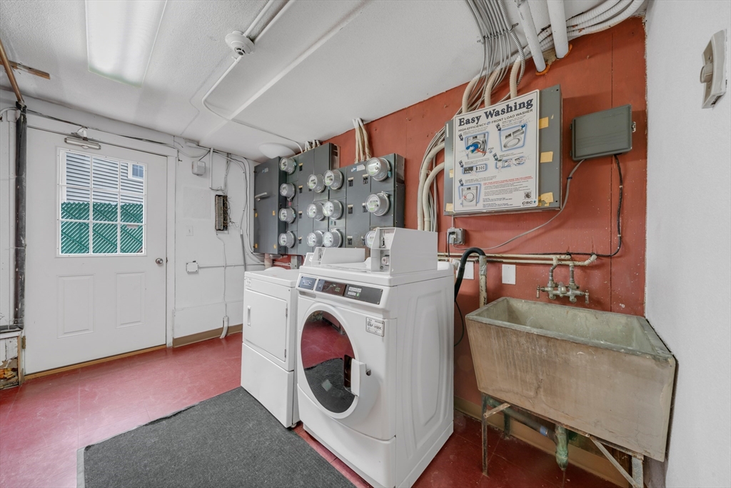 74 Beach Street, Unit 11 Woburn, MA 01801 - Photo 28 of 34 a utility room with dryer and washer