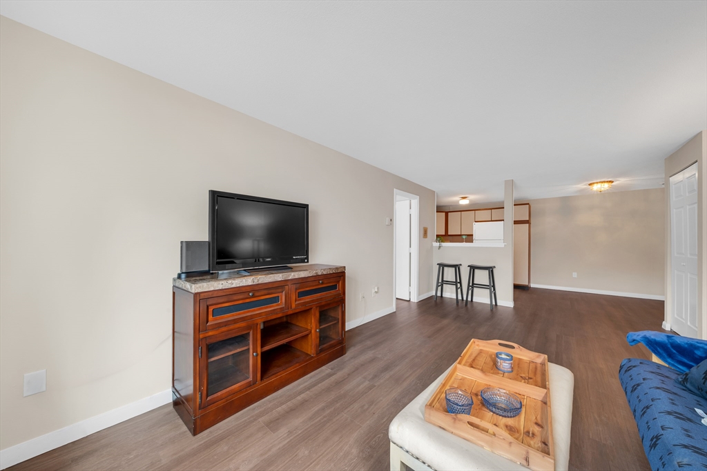 74 Beach Street, Unit 11 Woburn, MA 01801 - Photo 5 of 34 a living room with furniture and a flat screen tv