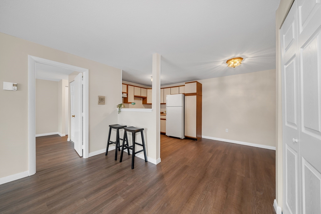 74 Beach Street, Unit 11 Woburn, MA 01801 - Photo 7 of 34 a view of a livingroom with furniture and wooden floor