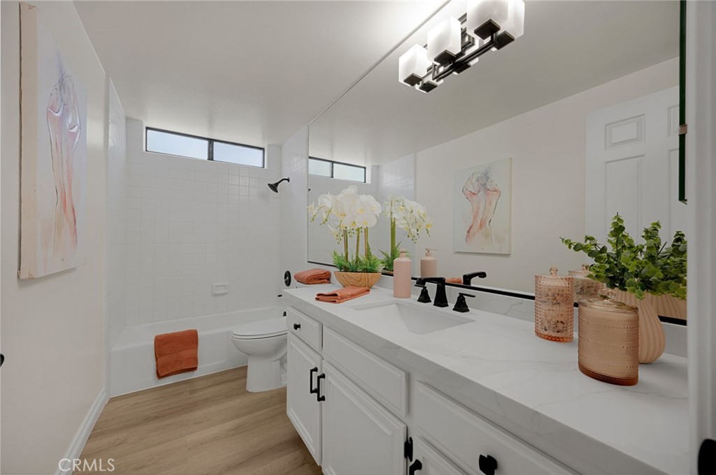2959 Bluebell Avenue Brea, CA 92821 - Photo 14 of 22 a bathroom with a sink a potted plant and a mirror