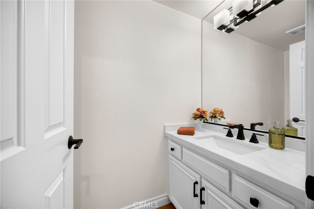 2959 Bluebell Avenue Brea, CA 92821 - Photo 16 of 22 a bathroom with a sink and a mirror