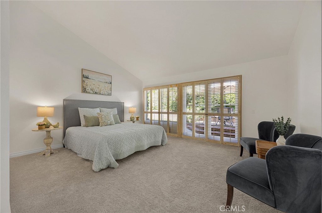 2959 Bluebell Avenue Brea, CA 92821 - Photo 8 of 22 a spacious bedroom with a bed and a couch next to a window