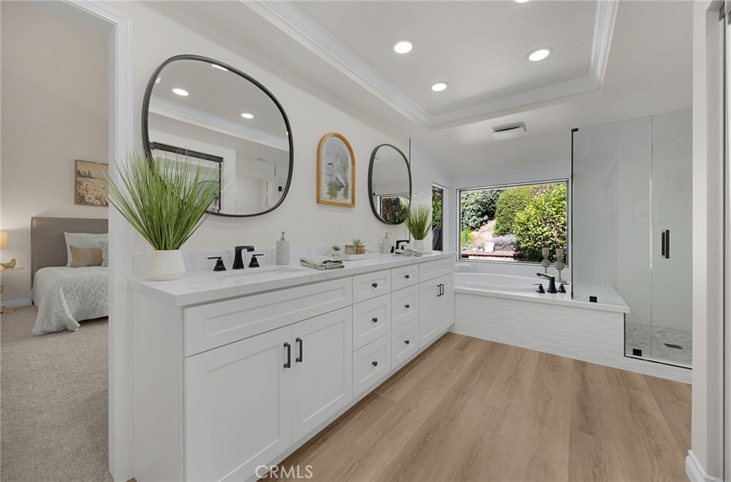 2959 Bluebell Avenue Brea, CA 92821 - Photo 9 of 22 a bathroom with a double vanity sink and mirror with bathtub